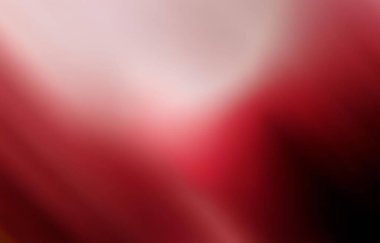 Açık tonlu kırmızı eğimli arkaplan daha koyu kırmızı ve siyah renklerde soluyor.