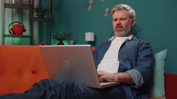 Displeased Middle Aged Bearded Man Use Laptop Typing Browsing Working — Stock Video