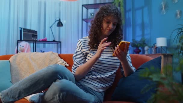 Sad Woman Curly Hairstyle Use Smartphone Typing Browsing Loses Becoming — Vídeo de stock