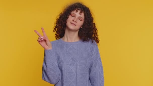Happy Curly Haired Young Woman Showing Victory Sign Hoping Success — Vídeos de Stock