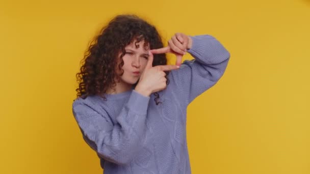 Curly Haired Woman Photographer Gesturing Picture Frame Hands Looks Fingers — Vídeos de Stock