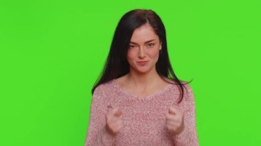 Angry aggressive pretty woman showing fig negative gesture, you dont get it anyway. Rapacious, avaricious, acquisitive. Body language. Refusal fig sign. Greedy avaricious girl on chroma key background