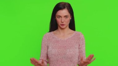 Hey you, be careful. Young woman warning with admonishing finger gesture, saying no, be careful, scolding and giving advice to avoid danger, disapproval sign. Girl isolated on chroma key background
