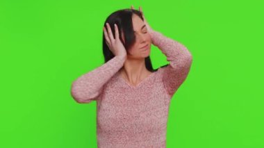 Dont want to hear and listen. Frustrated annoyed irritated one pretty woman covering ears gesturing No, avoiding advice ignoring unpleasant noise loud voices. Young girl on green chroma key background