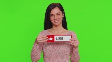 Lovely woman showing banner sign love like, comment, share. Pretty girl social media blogger waiting for online followers feedback and positive rate on internet isolated on green chroma key background