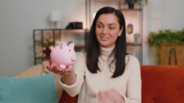 Poor Young Woman Insufficient Amount Money Holding Piggybank One Dollar — Stockvideo