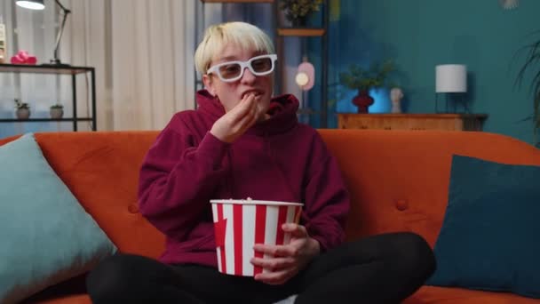 Excited Young Woman Sits Sofa Eating Popcorn Snacks Watching Interesting — Wideo stockowe