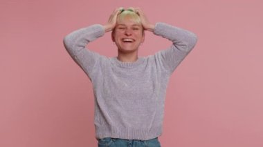 Woman with short hair laughing out loud after hearing ridiculous anecdote, funny joke, feeling carefree amused, positive people lifestyle. Young millennial girl on pink background. Lgbt gay lesbian