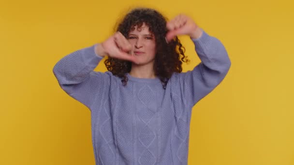 Dislike Upset Unhappy Curly Haired Young Woman Showing Thumbs Sign — Vídeo de Stock