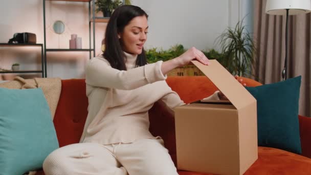 Happy Surprised Winner Young Woman Unpacking Delivery Parcel Home Smiling — Stock Video