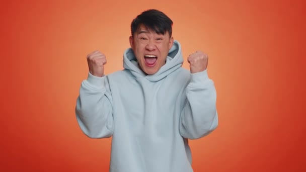 Happy Joyful Asian Man Shouting Raising Fists Gesture Did Celebrating — ストック動画