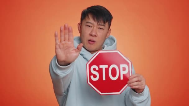 Serious Asian Man Say Hold Inscription Text Red Stop Danger — Vídeo de stock