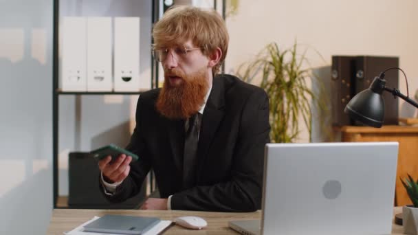Young Bearded Businessman Working Having Mobile Phone Loudspeaker Talk Office – Stock-video