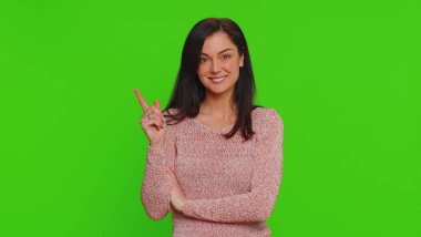 Eureka. Inspired woman pointing finger up with open mouth, having good idea, plan, startup, showing inspiration motivation gesture, problem solution. Young girl isolated on green chroma key background