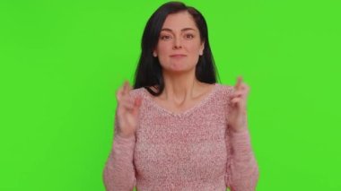 Woman with crossed fingers, feeling hopelessness loneliness, nervous breakdown, loses becoming surprised by lottery results, bad fortune, loss, unlucky news. Girl isolated on chroma key background