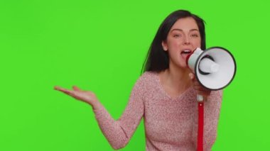Woman talking with megaphone, proclaiming news, loudly announcing advertisement, warning using loudspeaker to shout speech, pointing empty place. Copy-space promo. Young girl on chroma key background