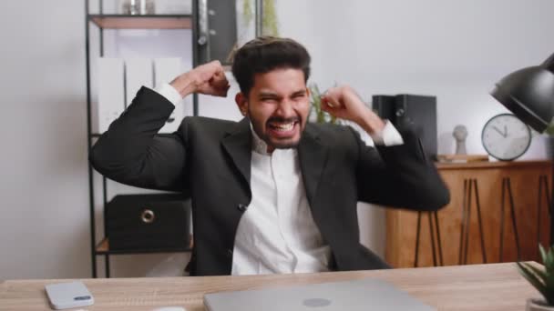 Happy Amazed Young Indian Businessman Working Laptop Shocked Sudden Victory — Stockvideo