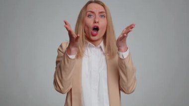 Business woman fingers crossed feeling hopelessness loneliness, nervous breakdown, loses becoming surprised by lottery results, bad fortune, loss, unlucky news. Girl isolated on studio gray background