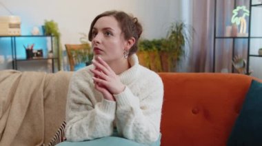 Eureka. Thoughtful clever inspired woman make positive gesture raises finger came up with creative plan feels excited with good idea, inspiration motivation. Portrait of girl at home in living room