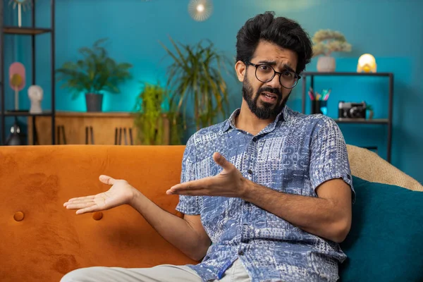 Indian man raising hands asking what why reason of failure, disbelief irritation by troubles, trendy social media meme, anti lifehacks, ridicules people who complicate simple tasks for no reason, home