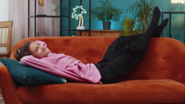 Tired Happy Preteen School Girl Lying Orange Couch Taking Rest — Stock Video