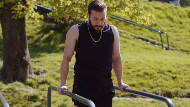 Athletic Lebanese Man Sportswear Practicing Dips Parallel Bars Training Triceps — Stock Video