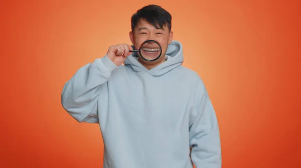 Asian Man Holding Magnifier Glass Healthy White Teeth Looking Camera — Fotografia de Stock