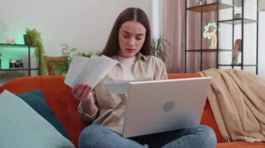 Stresli bir kadın, bankanın ödenmemiş borçlarına bakıyor, evrak işleriyle uğraşıyor, bütçe planlıyor, mortgage ödemelerini hesaplıyor. Kızın portresi kanepeye kağıt para atıyor. Yaşam Tarzları