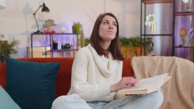Repair work at neighbours. Irritated woman girl relaxing on couch cover ears with pillows annoyed by noisy neighbors suffer from headache wish silence. Thin walls at home flat without sound insulation