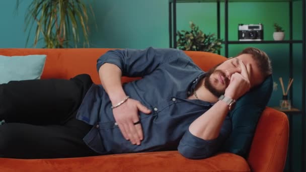 Young Lebanese Man Lying Sofa Feeling Sudden Strong Abdominal Stomach — Stock Video