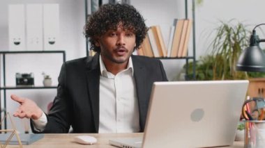 Conflict Quarrel Negotiation. Angry businessman ceo making webcam laptop online video call at office. Upset mad freelancer man talking colleague conversation analyzing financial report mistake problem