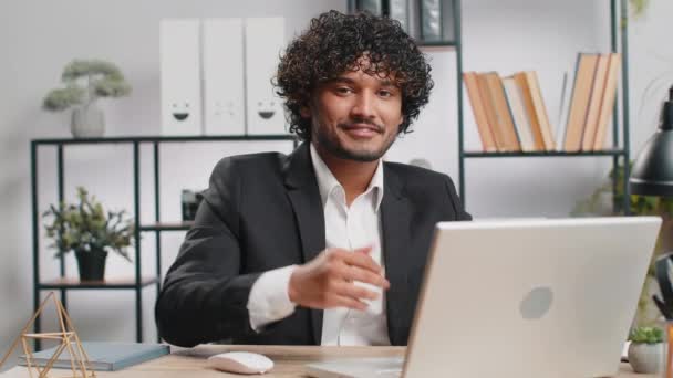 Happy Young Indian Businessman Guy Working Laptop Looking Approvingly Camera — Wideo stockowe