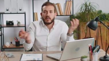 I dont know what to say. Confused business man working on laptop at office workplace. Freelancer feeling embarrassed about ambiguous question, having doubts, no answer idea, being clueless, uncertain