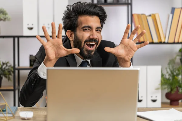 Indian Businessman Hiding Laptop Computer Making Funny Face Fooling Remote — Stockfoto