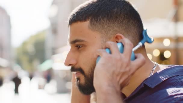Profile Happy Overjoyed Indian Young Man Wearing Wireless Headphones Choosing — Stock Video