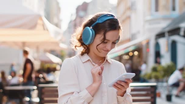 Happy Relaxed Overjoyed Pretty Young Woman Wireless Headphones Choosing Listening — Stock Video