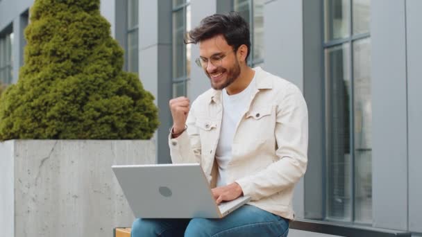 Overjoyed Happy Young Indian Man Working Laptop Scream Delight Raise — Stock Video