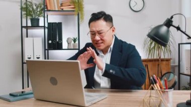 Conflict Quarrel Negotiation. Angry businessman CEO making webcam laptop online video call at office. Upset mad freelancer man talking colleague conversation analyzing financial report mistake problem