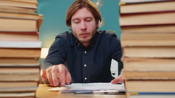 Exhausted Businessman Moving Stacks Books Reviewing Documents Reports While Drinking — Stock Video