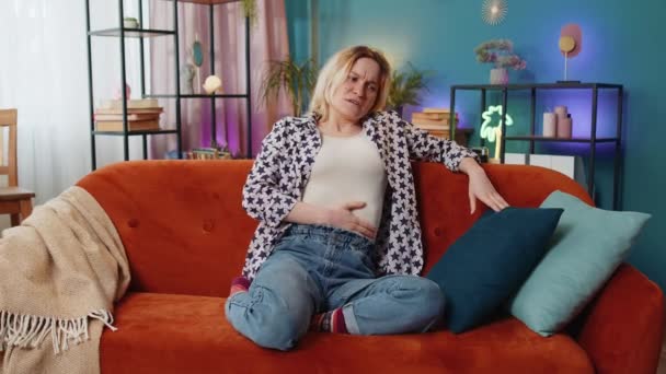 Upset Young Woman Embracing Belly Suffering Stomachache Lying Sofa Unhappy — Vídeo de stock