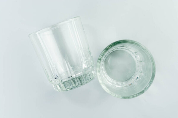 empty glass cup on a light gray background