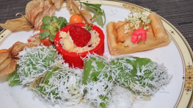 Klepon is a traditional rice cake ball filled with molten palm sugar. Indonesian traditional cake