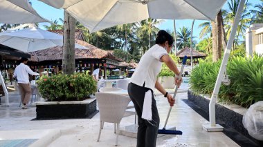 Hotel workers when cleaning restaurant facilities so that guests are comfortable,Bali island, December 9 2022