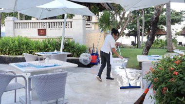 Hotel workers when cleaning restaurant facilities so that guests are comfortable,Bali island, December 9 2022