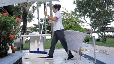 Hotel workers when cleaning restaurant facilities so that guests are comfortable,Bali island, December 9 2022
