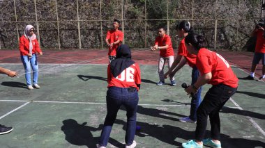 group of people are playing team working Game to build a teamwork, Semarang Indonesia, December 17, 2022