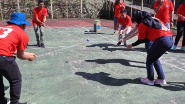 group of people are playing team working Game to build a teamwork, Semarang Indonesia, December 17, 2022
