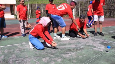 group of people are playing team working Game to build a teamwork, Semarang Indonesia, December 17, 2022