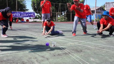 group of people are playing team working Game to build a teamwork, Semarang Indonesia, December 17, 2022
