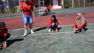 group of people are playing team working Game to build a teamwork, Semarang Indonesia, December 17, 2022